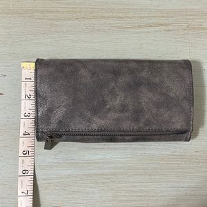 Wallet silver grey in color.